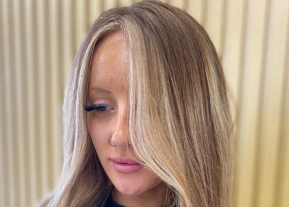 Blonde hair with highlights styled at Cabello, Birstall, England, GB. Modern and elegant hair design.