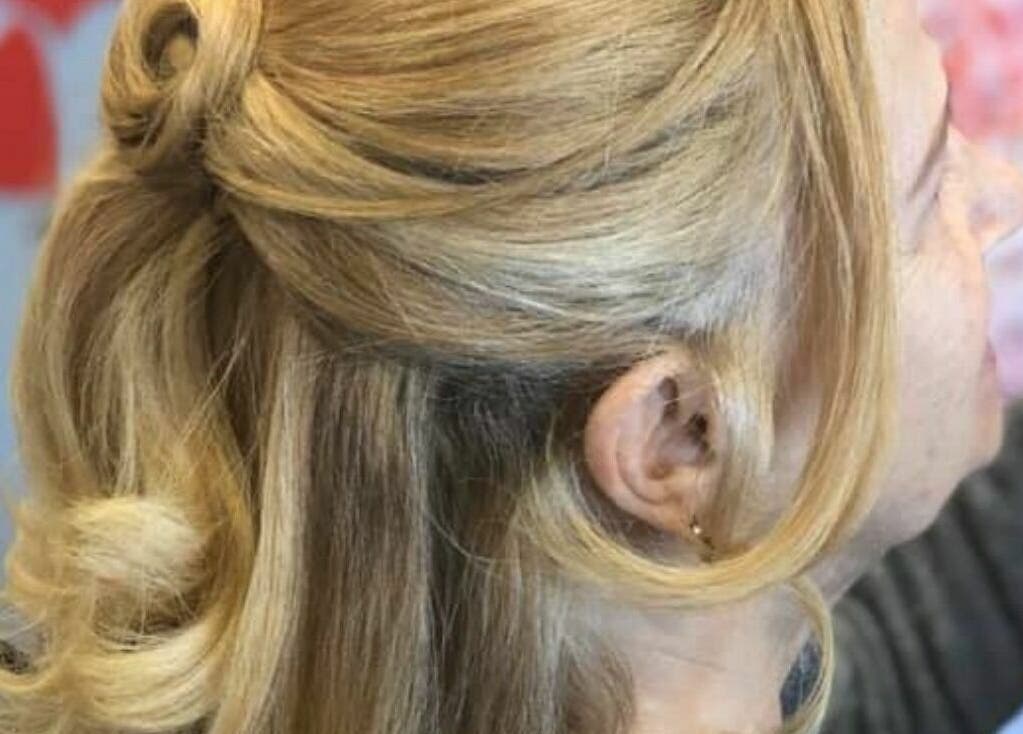 Blonde updo hairstyle at Makeover Planet, Poughkeepsie, New York, US. Perfect for elegant events.