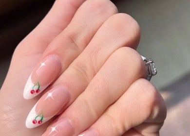 Elegant cherry nail art on manicured hand at Me Time, Edenvale, Gauteng, ZA. Perfect for beauty enthusiasts.