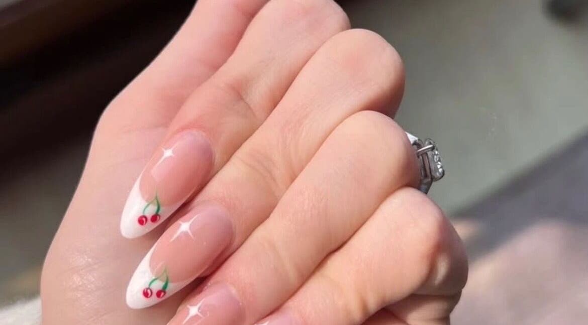 Elegant cherry nail art on manicured hand at Me Time, Edenvale, Gauteng, ZA. Perfect for beauty enthusiasts.