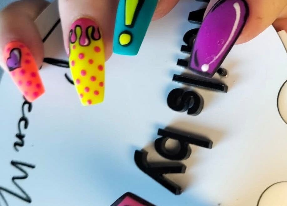 Colorful nail art at Me Time, Edenvale, Gauteng, ZA showcasing vivid patterns and designs.