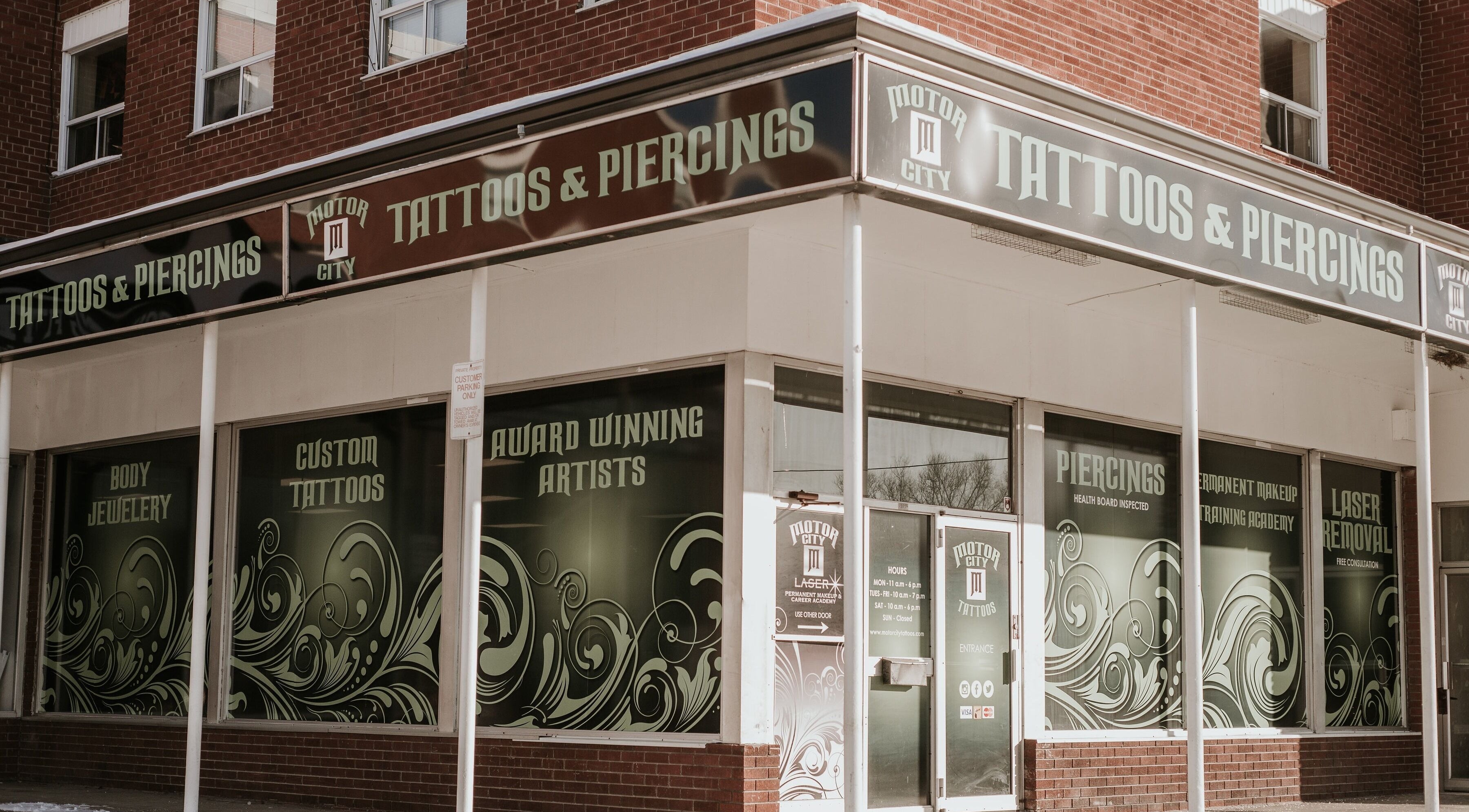 Exterior of Motor City Tattoo Studio Oshawa showcasing signage in Oshawa, Ontario, CA.