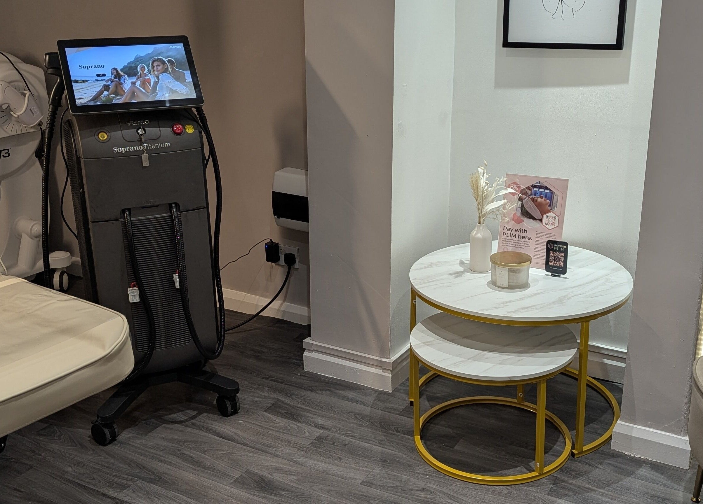 Modern treatment room at The Laser Clinic, Halifax, England, GB with equipment and cozy seating.