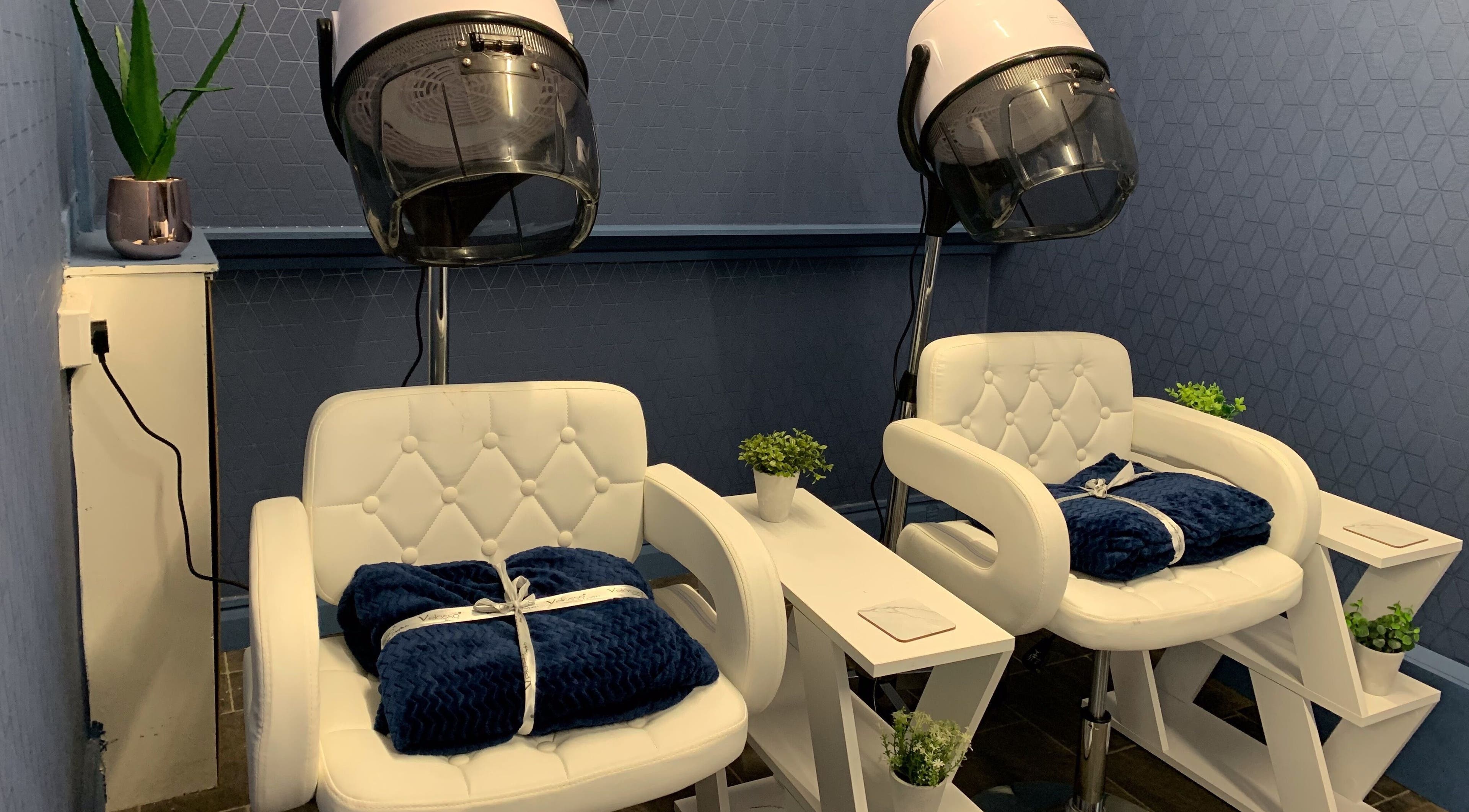 Comfortable salon chairs in Amelie Jacques Salon, Derby, England, GB, offering a relaxing beauty experience.