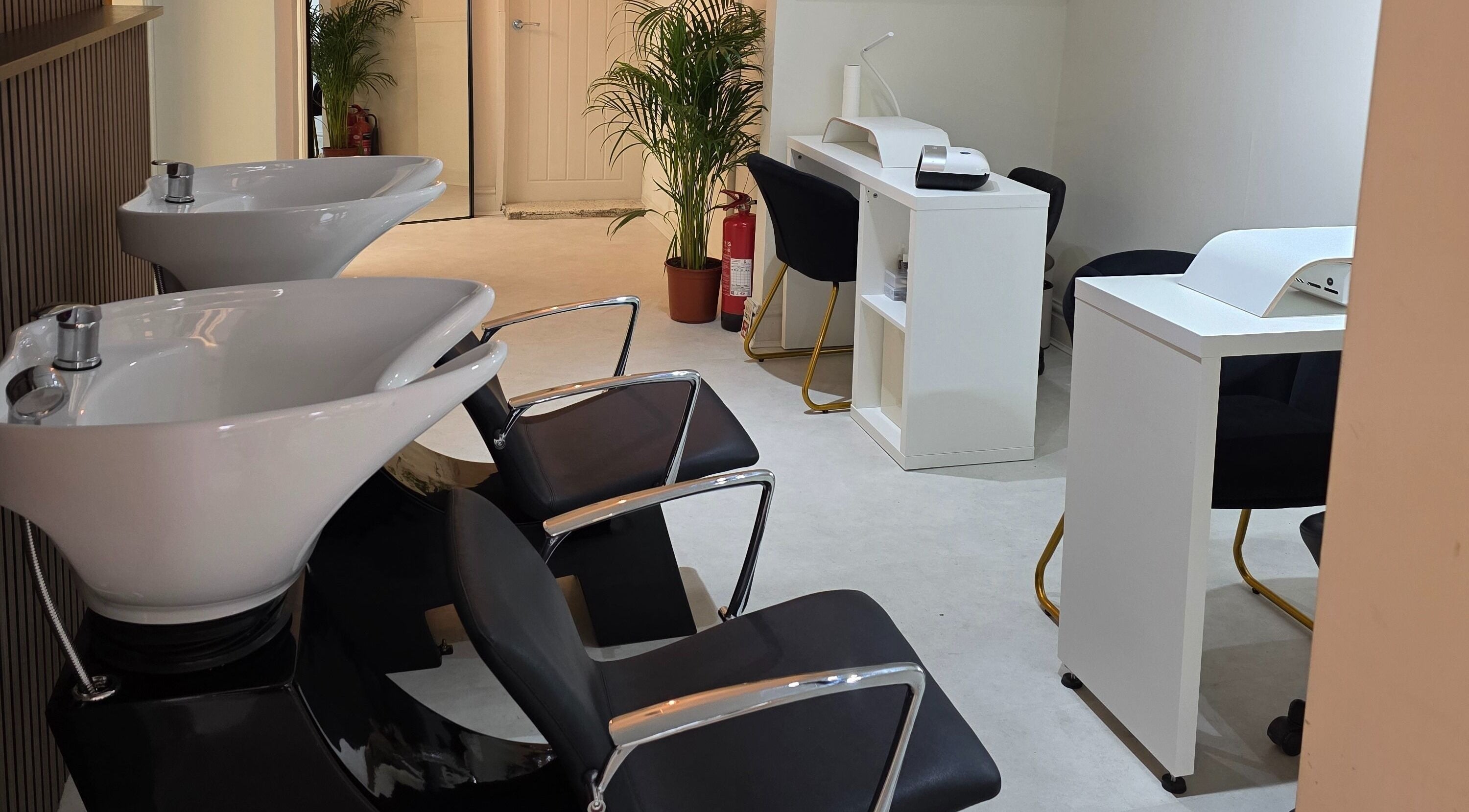 Elegant hair washing and nail station at Raine Hair and Beauty, Neston, England, GB, offering stylish wellness.