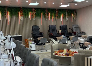 Luxurious spa chairs at Get The Gloss, Hamilton, Scotland, GB with foliage decor and serene ambiance.