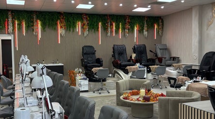 Luxurious spa chairs at Get The Gloss, Hamilton, Scotland, GB with foliage decor and serene ambiance.