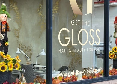 Get The Gloss storefront displays autumn decor with sunflowers in Hamilton, Scotland, GB.