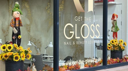 Get The Gloss storefront displays autumn decor with sunflowers in Hamilton, Scotland, GB.