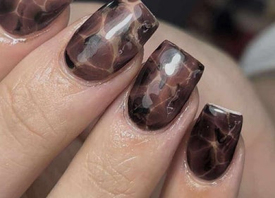 Chic brown marble nail art at Get The Gloss, Hamilton, Scotland, GB. Perfect for a stylish look.