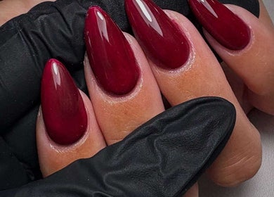 Elegant crimson nails at Get The Gloss in Hamilton, Scotland, GB, showcasing professional nail artistry.