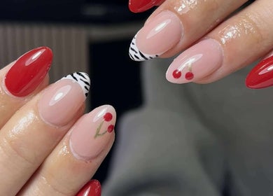 Vibrant red and zebra patterned nails by Get The Gloss in Hamilton, Scotland, GB.