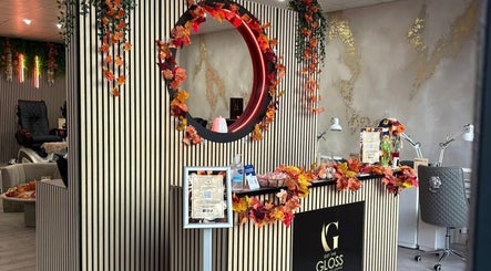 Chic front desk at Get The Gloss, Hamilton, Scotland, GB, adorned with vibrant autumn decor.
