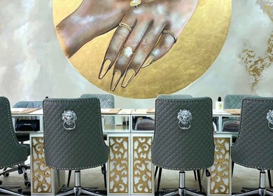 Luxurious nail salon seats under artistic wall art at Get The Gloss, Hamilton, Scotland, GB.
