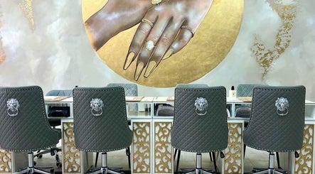 Luxurious nail salon seats under artistic wall art at Get The Gloss, Hamilton, Scotland, GB.