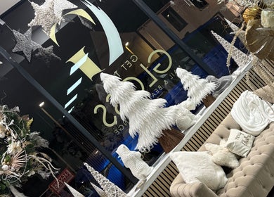 Elegant winter decor at Get The Gloss, Hamilton, Scotland, GB. Features stars, wreath, and plush seating.