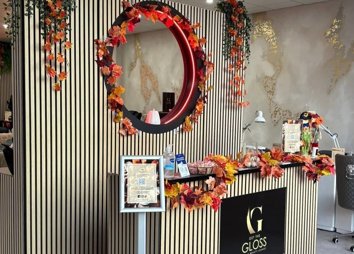 Reception area at Get The Gloss, Hamilton, Scotland, GB with autumn decor and modern design.