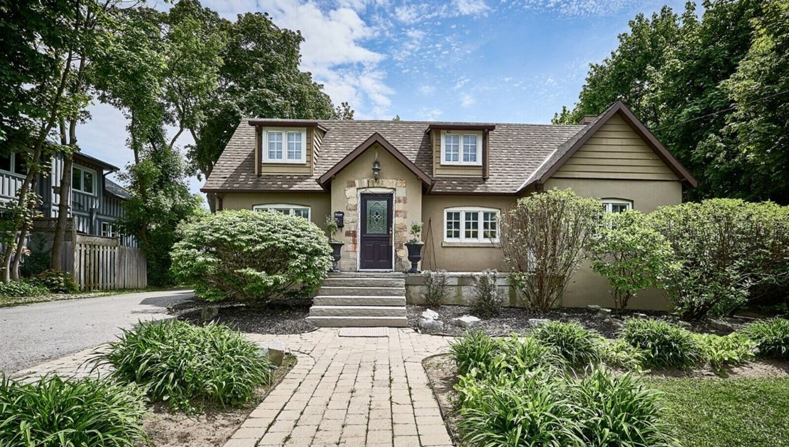 Charming exterior of Ignite Your Soul Wellness Spa, Ajax, Ontario, CA surrounded by lush greenery.