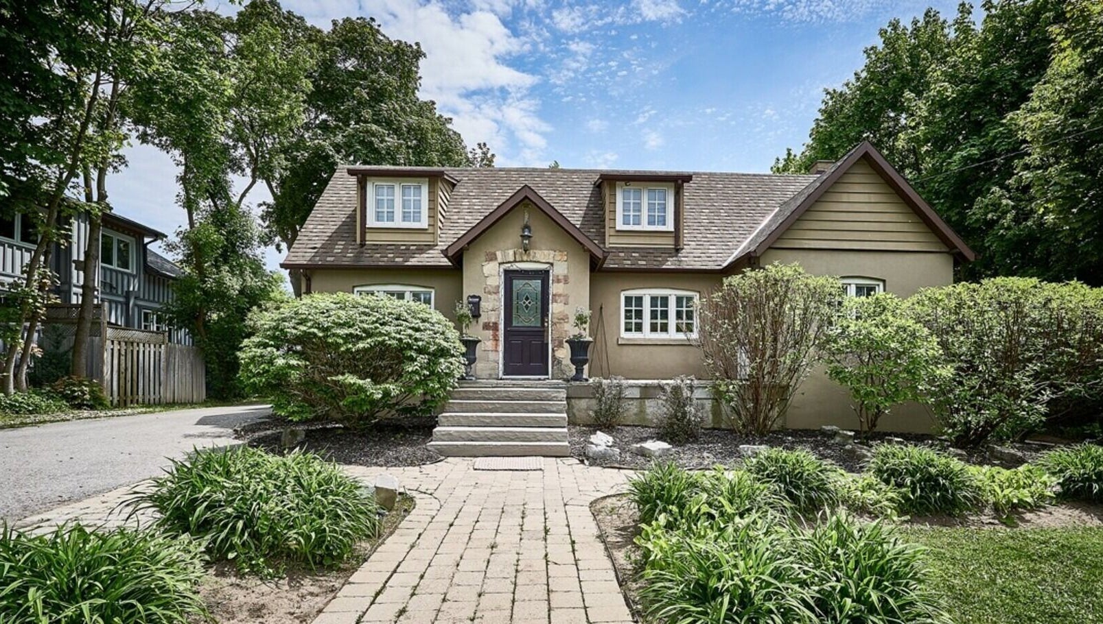 Charming exterior of Ignite Your Soul Wellness Spa, Ajax, Ontario, CA surrounded by lush greenery.