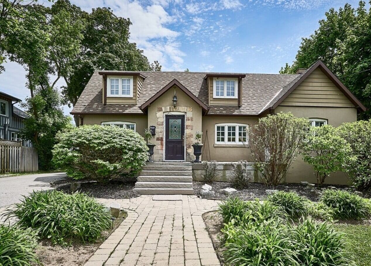 Charming exterior of Ignite Your Soul Wellness Spa, Ajax, Ontario, CA surrounded by lush greenery.