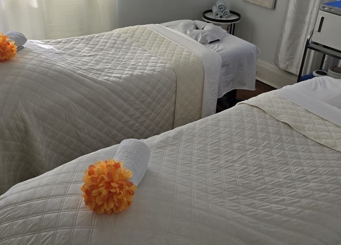 Cozy treatment beds at Ignite Your Soul Wellness Spa in Ajax, Ontario, CA, ready for a soothing therapy session.