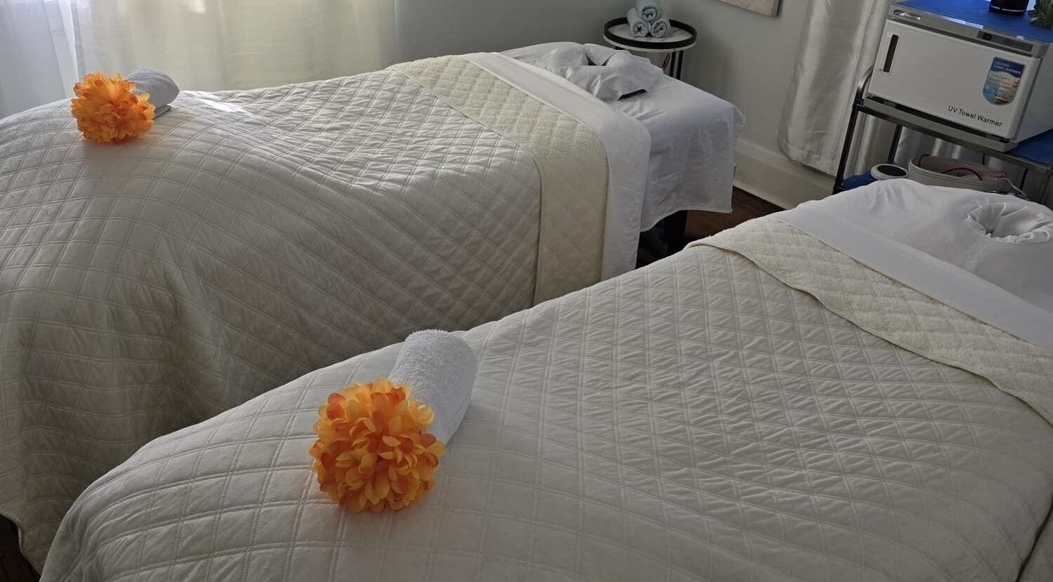 Cozy treatment beds at Ignite Your Soul Wellness Spa in Ajax, Ontario, CA, ready for a soothing therapy session.