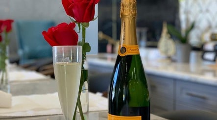 Champagne and roses at Champagne Nail Bar, Santa Barbara, California, US, offering luxury nail experiences.