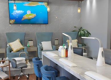 Elegant interior of Champagne Nail Bar in Santa Barbara, California, US, featuring chic manicure stations.