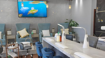 Elegant interior of Champagne Nail Bar in Santa Barbara, California, US, featuring chic manicure stations.