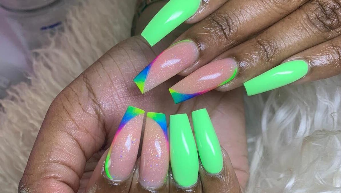 Vibrant neon nail art at Slay By Daè in St. James, BB showcasing intricate design.