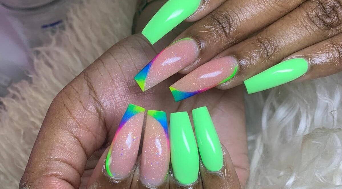 Vibrant neon nail art at Slay By Daè in St. James, BB showcasing intricate design.