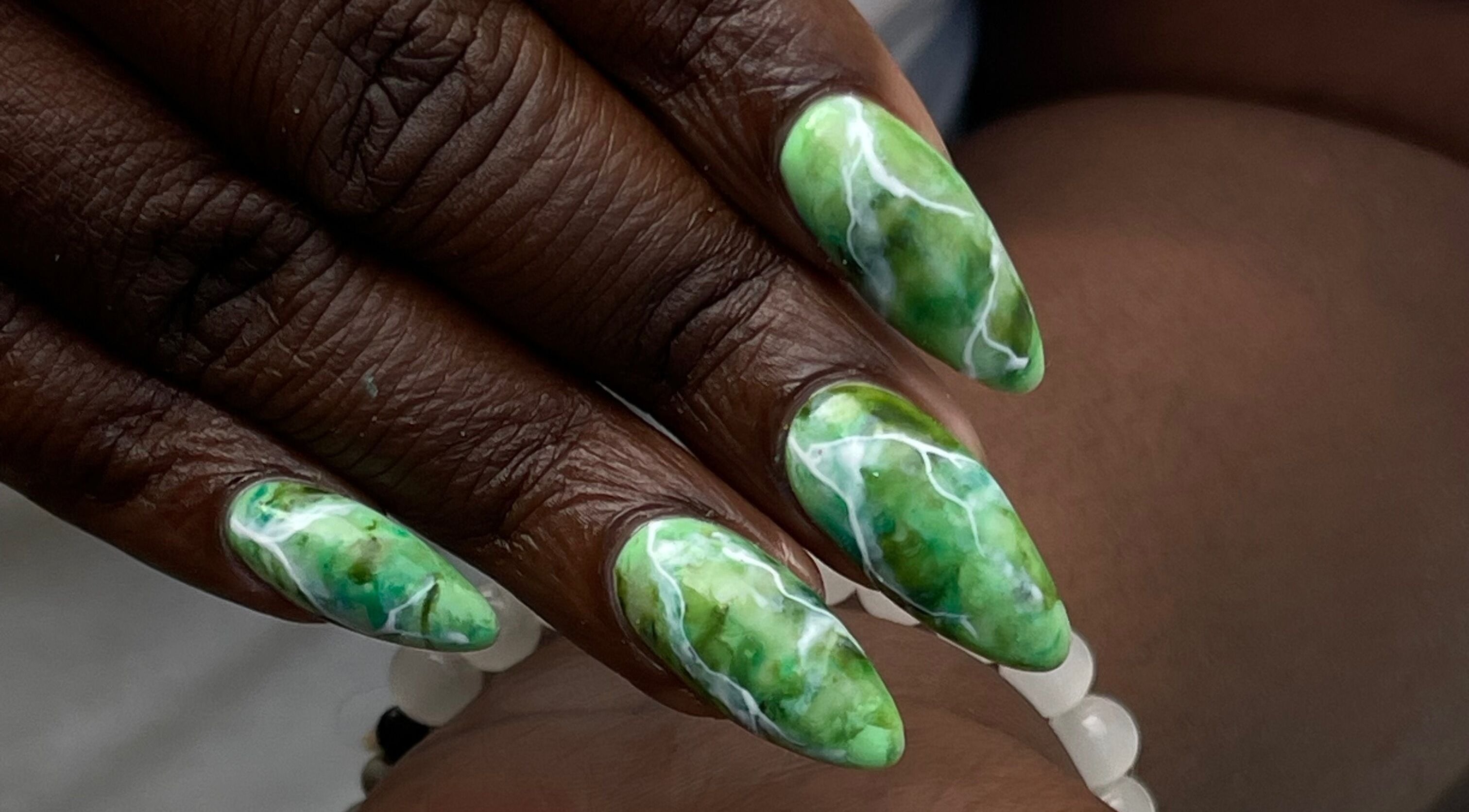 Green marble nail art by Slay By Daè, St. James, BB. Stunning and intricate design.