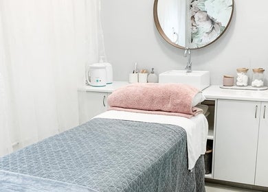 Relaxing spa treatment room at Zovia Beauty in Griffith, Australian Capital Territory, AU, featuring plush linens.