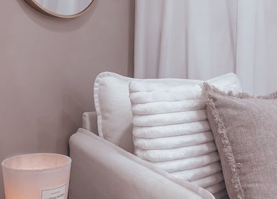 Cozy seating area with cushions and candle at Zovia Beauty, Griffith, Australian Capital Territory, AU.