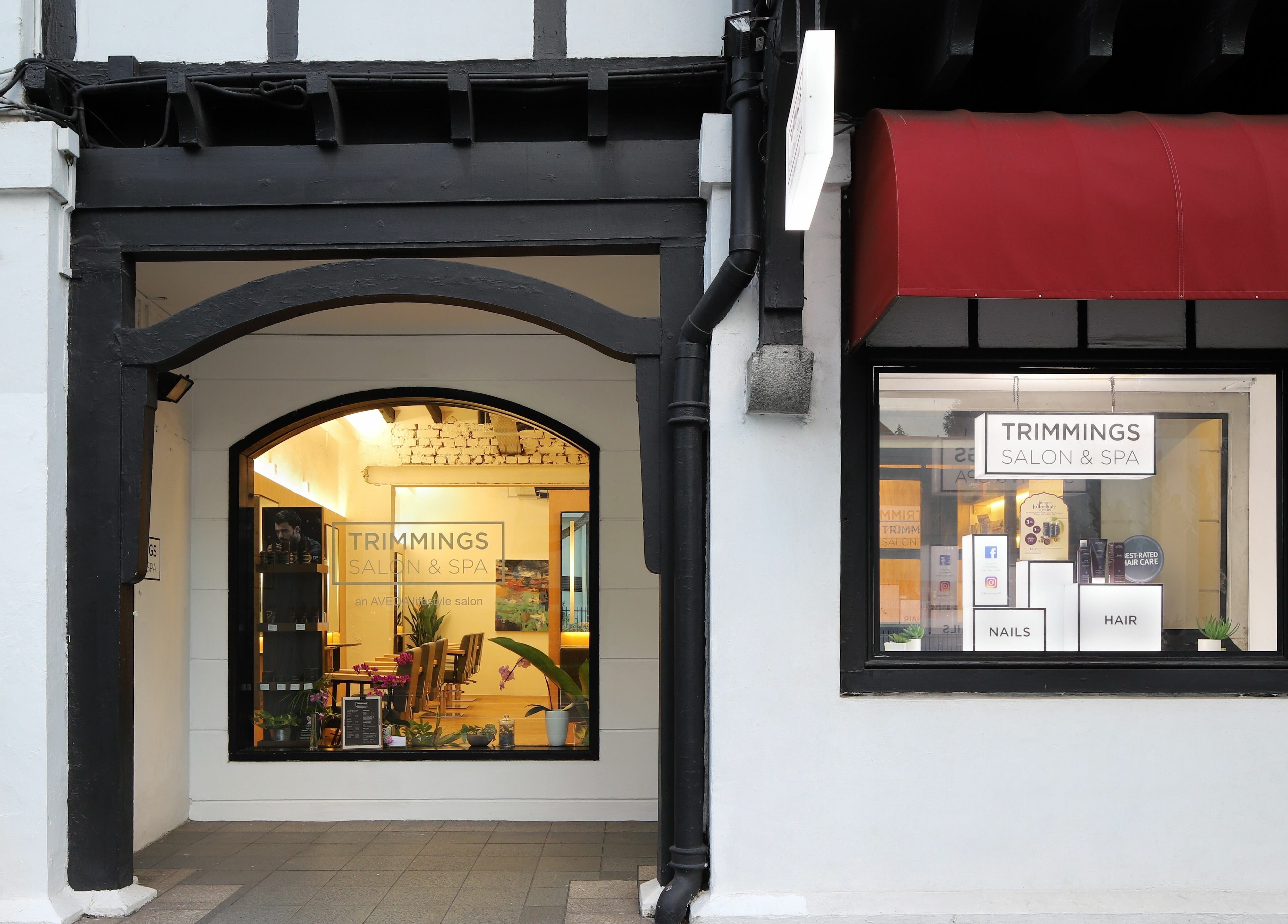 Entrance of Trimmings Salon and Spa | Orchard Road, Singapore, Singapore, SG with elegant black and white design.