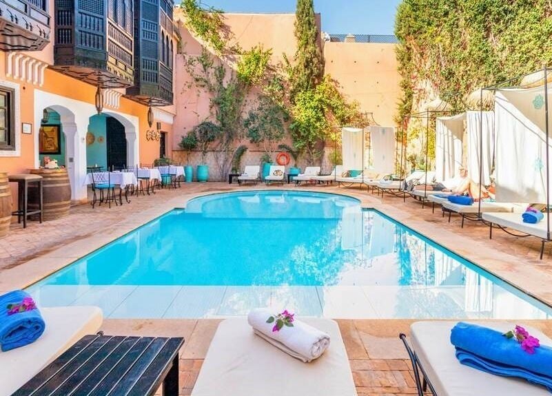 Relaxing poolside at Spa Les Borjs de la Kasbah, Marrakesh, Marrakesh-Safi, MA, with sun loungers and cozy ambiance.