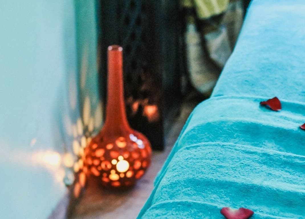 Cozy massage bed with warm lighting at Spa Les Borjs de la Kasbah, Marrakesh, Marrakesh-Safi, MA.