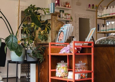 Stylish waiting area at LK Hair and Beauty, Newbury, England, GB, featuring elegant decor and beauty products.