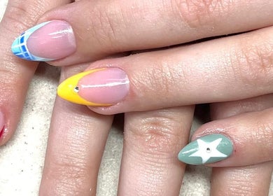 Colorful artistic nails at Suzi Q Nails, Melbourne, Victoria, AU, showcasing trendy design.