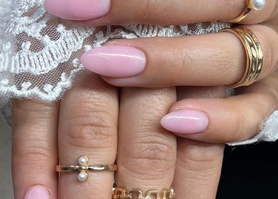 Beautiful pink manicured nails at Suzi Q Nails, Melbourne, Victoria, AU with lace details and gold rings.