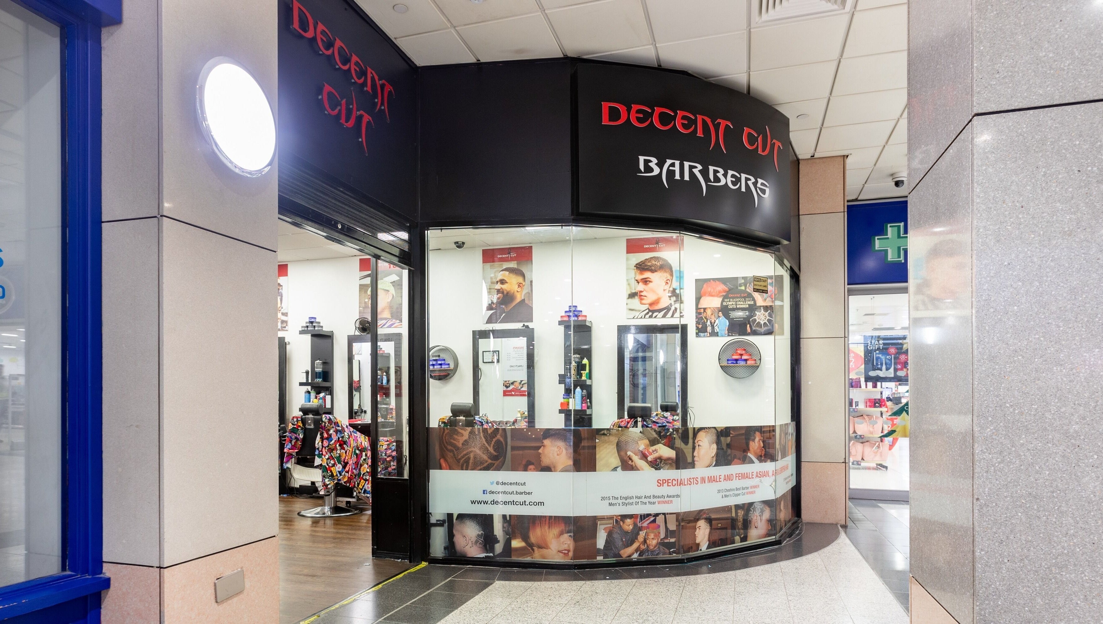 Exterior of Decent Cut barbershop in Manchester, England, GB showcasing modern styling services.