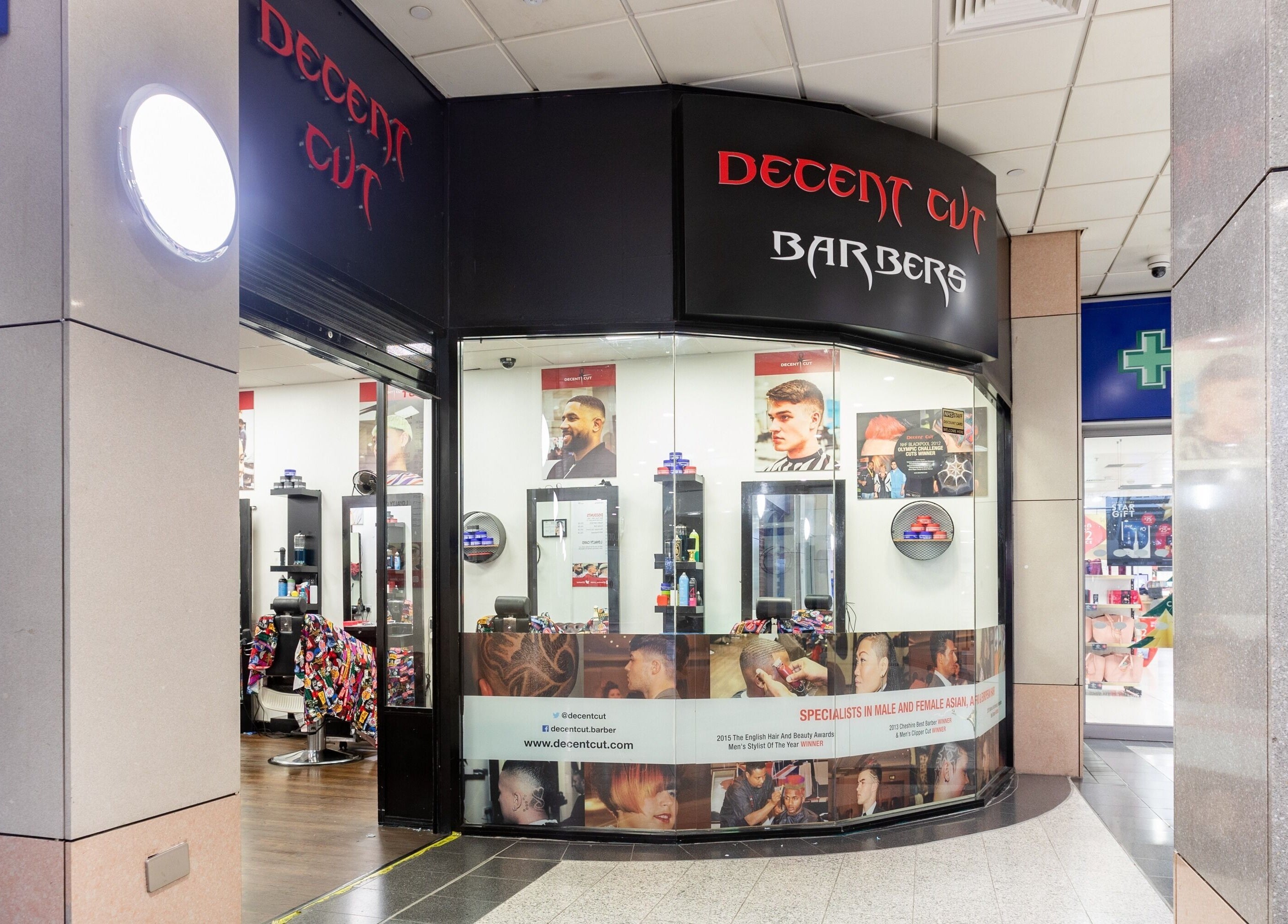 Exterior of Decent Cut barbershop in Manchester, England, GB showcasing modern styling services.