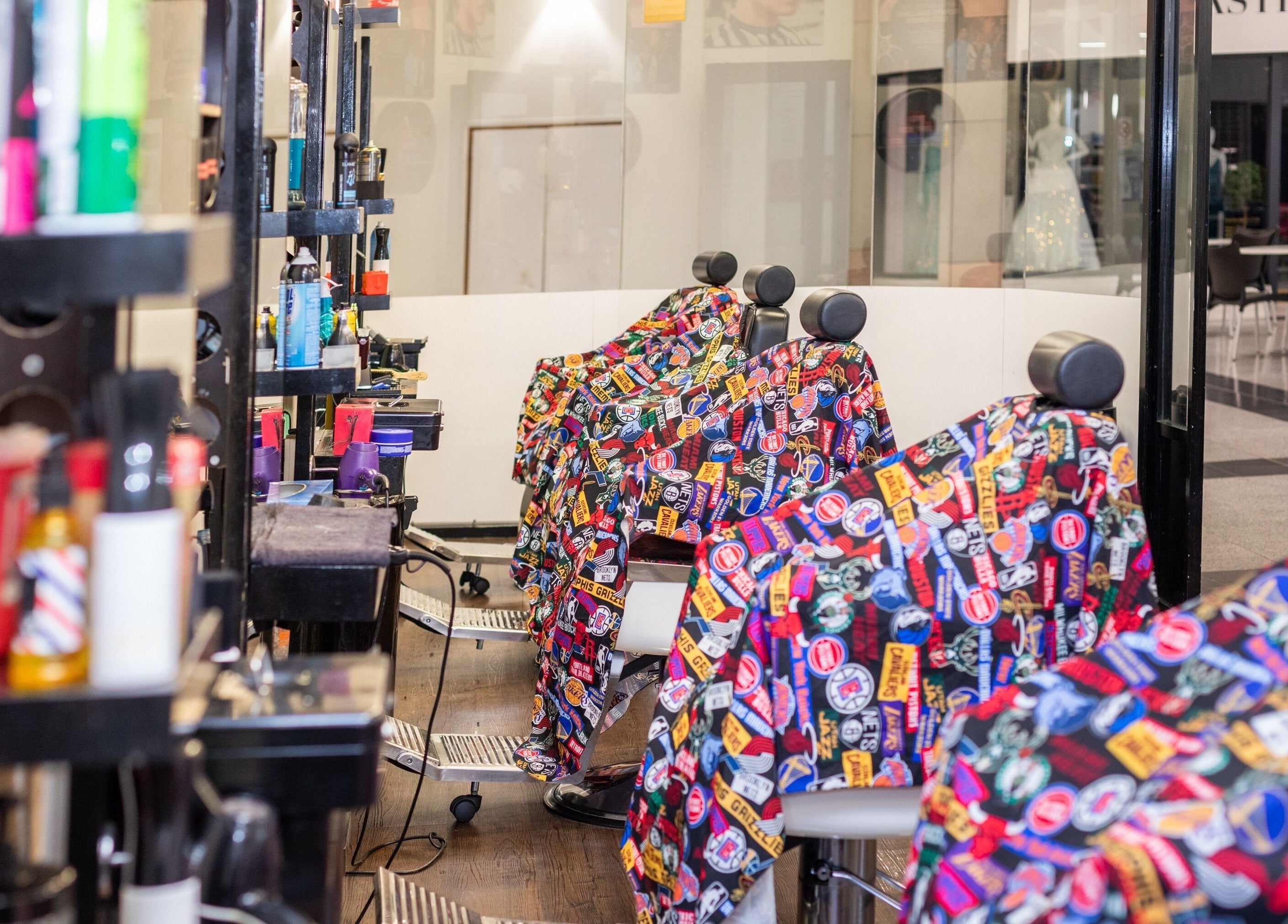 Bright, colorful salon chairs at Decent Cut in Manchester, England, GB ready to welcome customers.