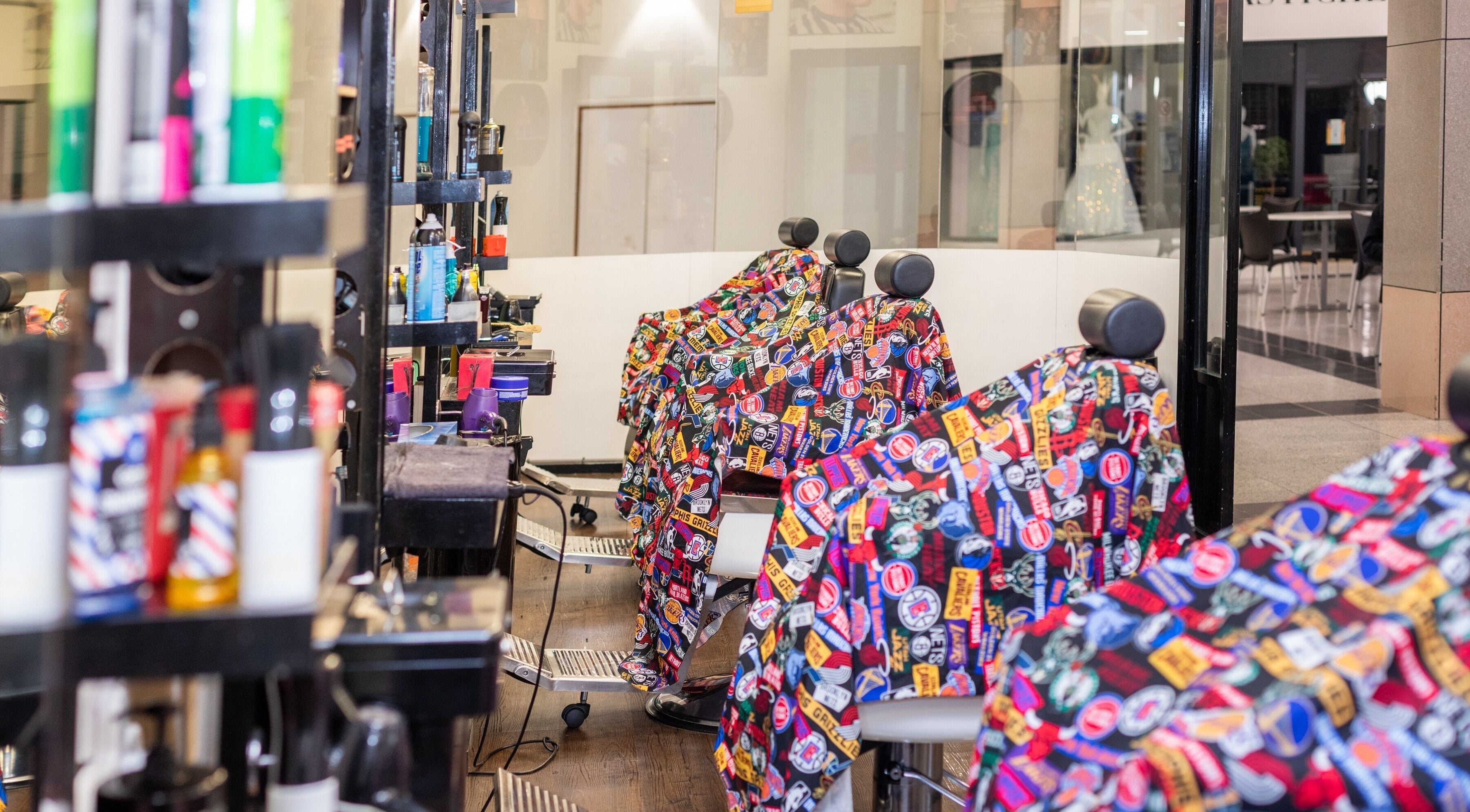 Bright, colorful salon chairs at Decent Cut in Manchester, England, GB ready to welcome customers.