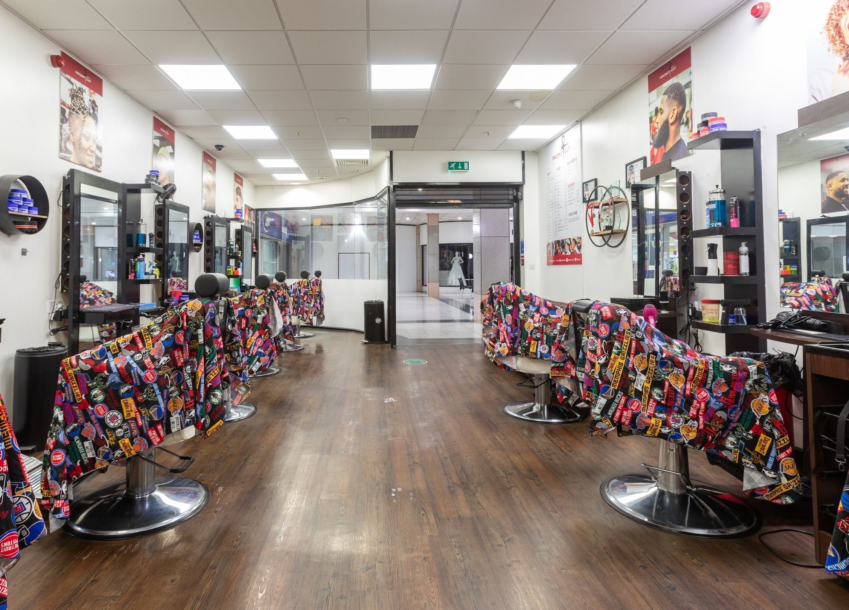 Interior of Decent Cut in Manchester, England, GB, showcasing modern salon chairs and decor.