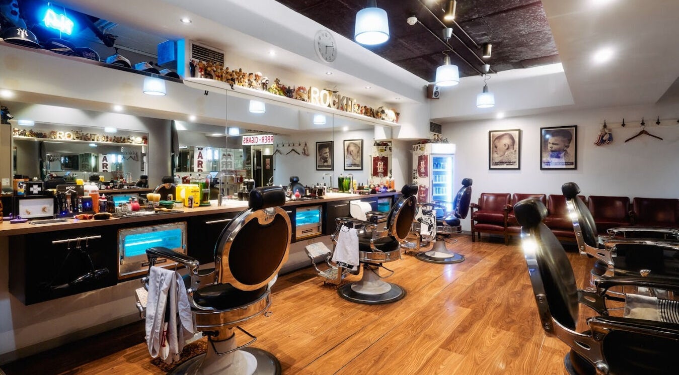 Stylish interior of Rockit Barbershop in Melbourne, Victoria, AU with modern barber chairs and decor.