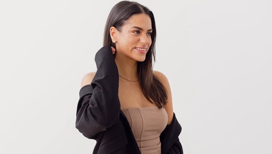 Smiling woman with stylish attire at Little Lash Lab, Melbourne, Victoria, AU.