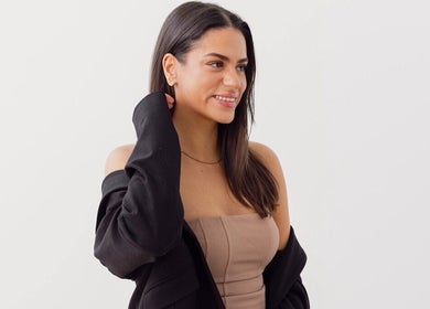 Smiling woman with stylish attire at Little Lash Lab, Melbourne, Victoria, AU.