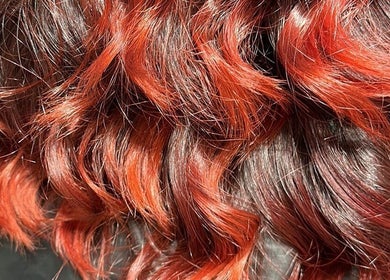 Vibrant red curls styled at Costyle Hairdresser Salon, Morley, Western Australia, AU.