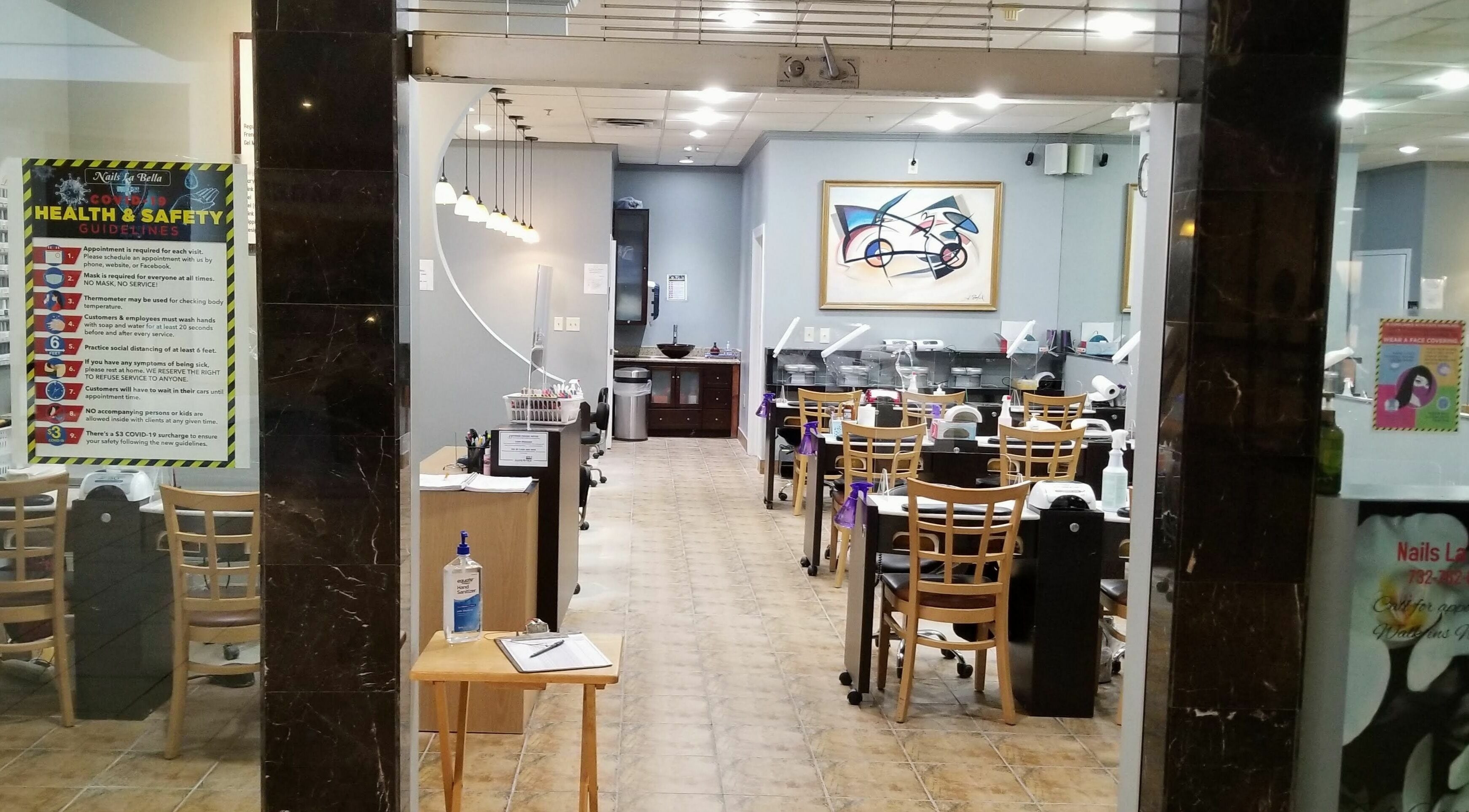 Interior view of Nails La Bella in Freehold Township, New Jersey, US showcasing elegant nail stations.